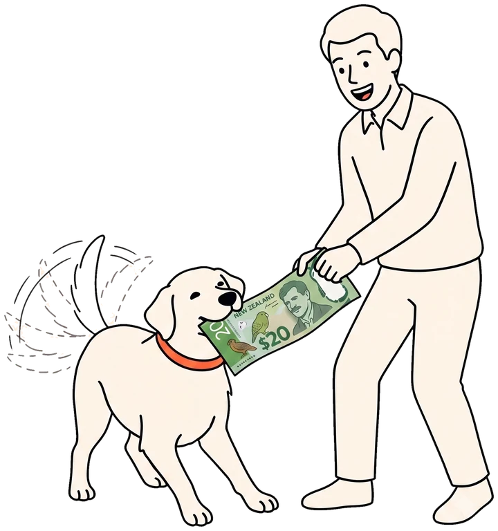 A dog and its owner playfully tugging over a New Zealand $20 note